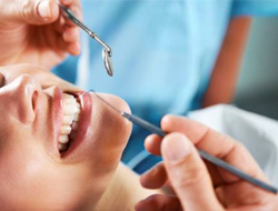 Dentist working on patient