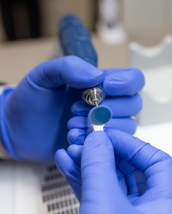 Close up of a dental team member designing a dental crown