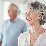 An older couple with dental implants in Ellington smiling