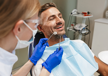 Man smiling during a dental checkup