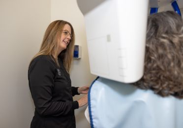 Zahner Dental team member taking a scan of a patients mouth and jaws