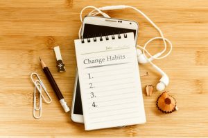 notebook with a list named "change habits"