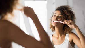 Person practicing oral hygiene during COVID-19