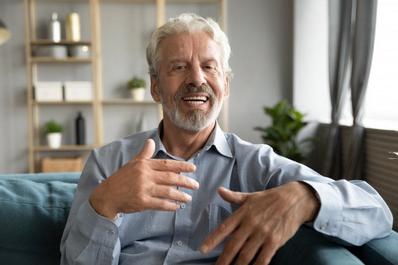 man smiling with dentures in Ellington