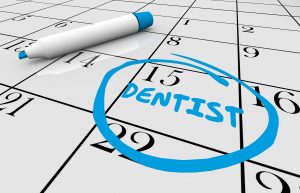 Appointment with dentist circled on calendar. 