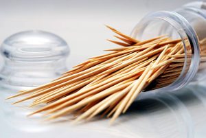 Toothpicks in glass container