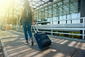 Woman traveling with Invisalign